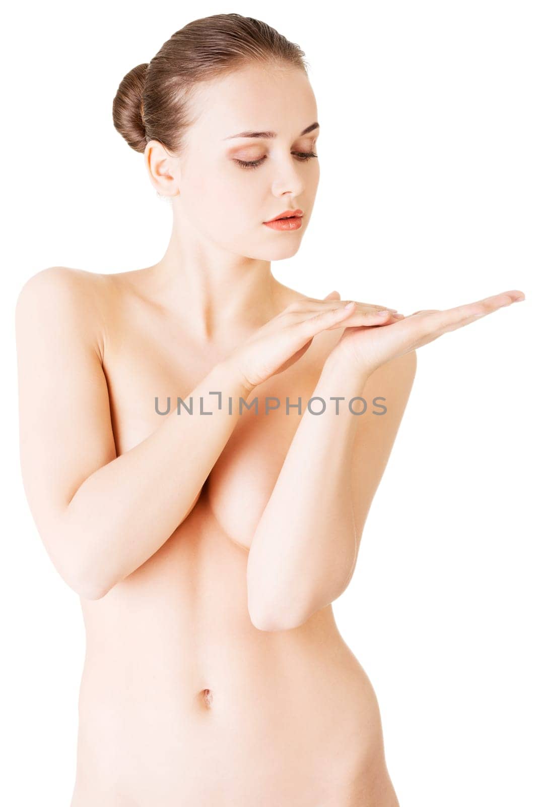 attractive woman with her hand covering breasts. touching hands.front view. isolated on white.