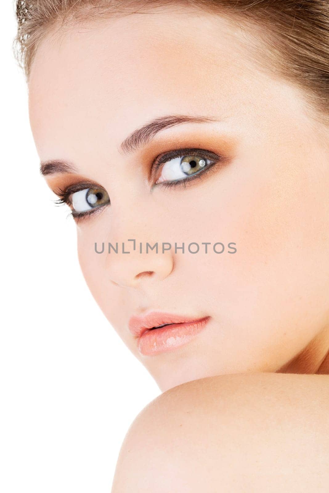 attractive young woman's face. closeup. isolated on white.