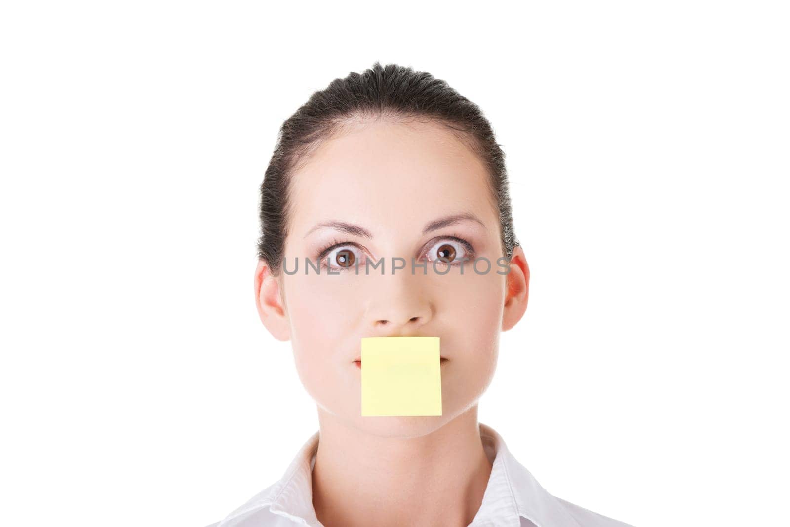 attractive woman's face with empty card on lips. isolated on white.