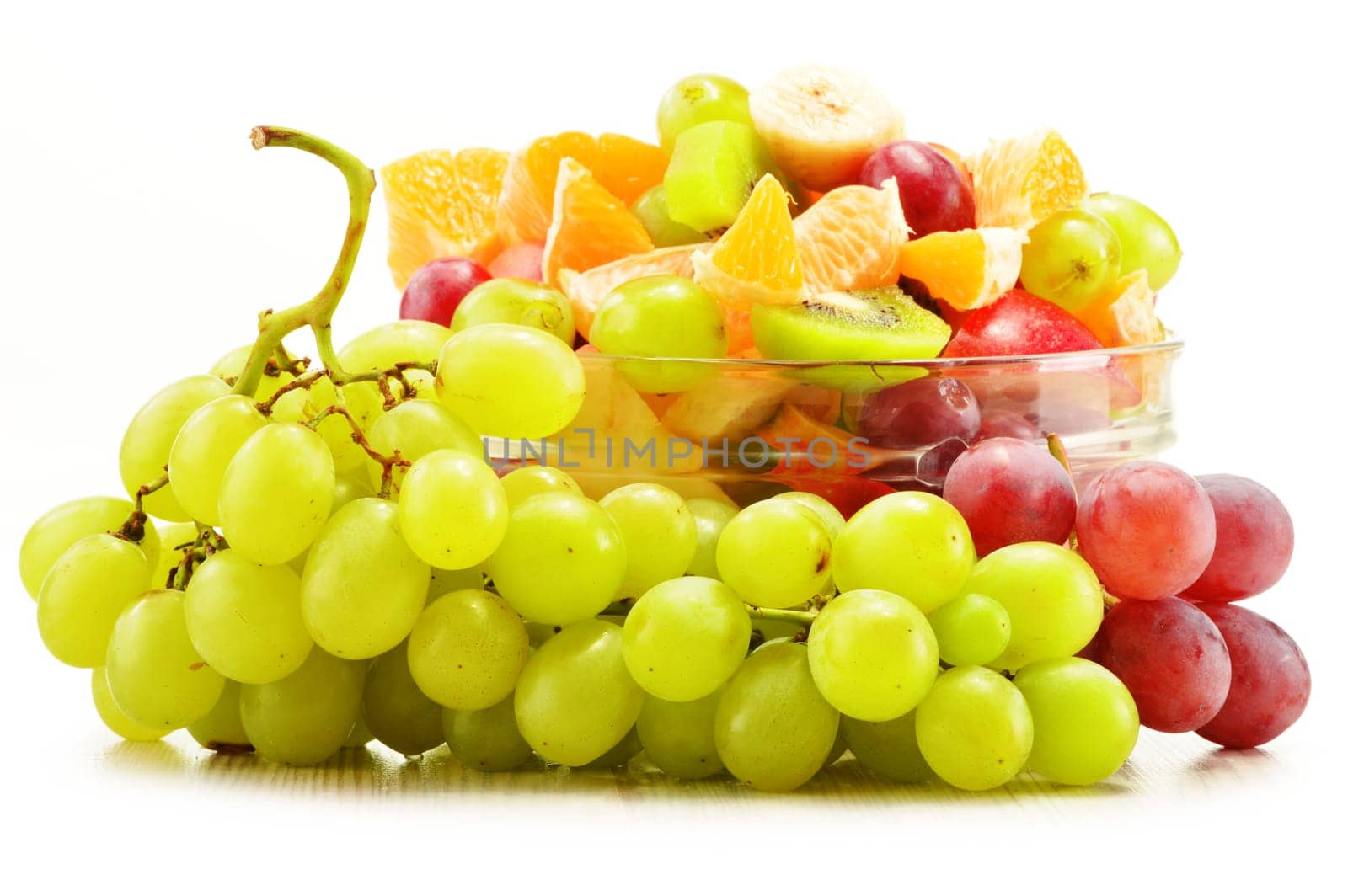Fruit salad bowl isolated on white