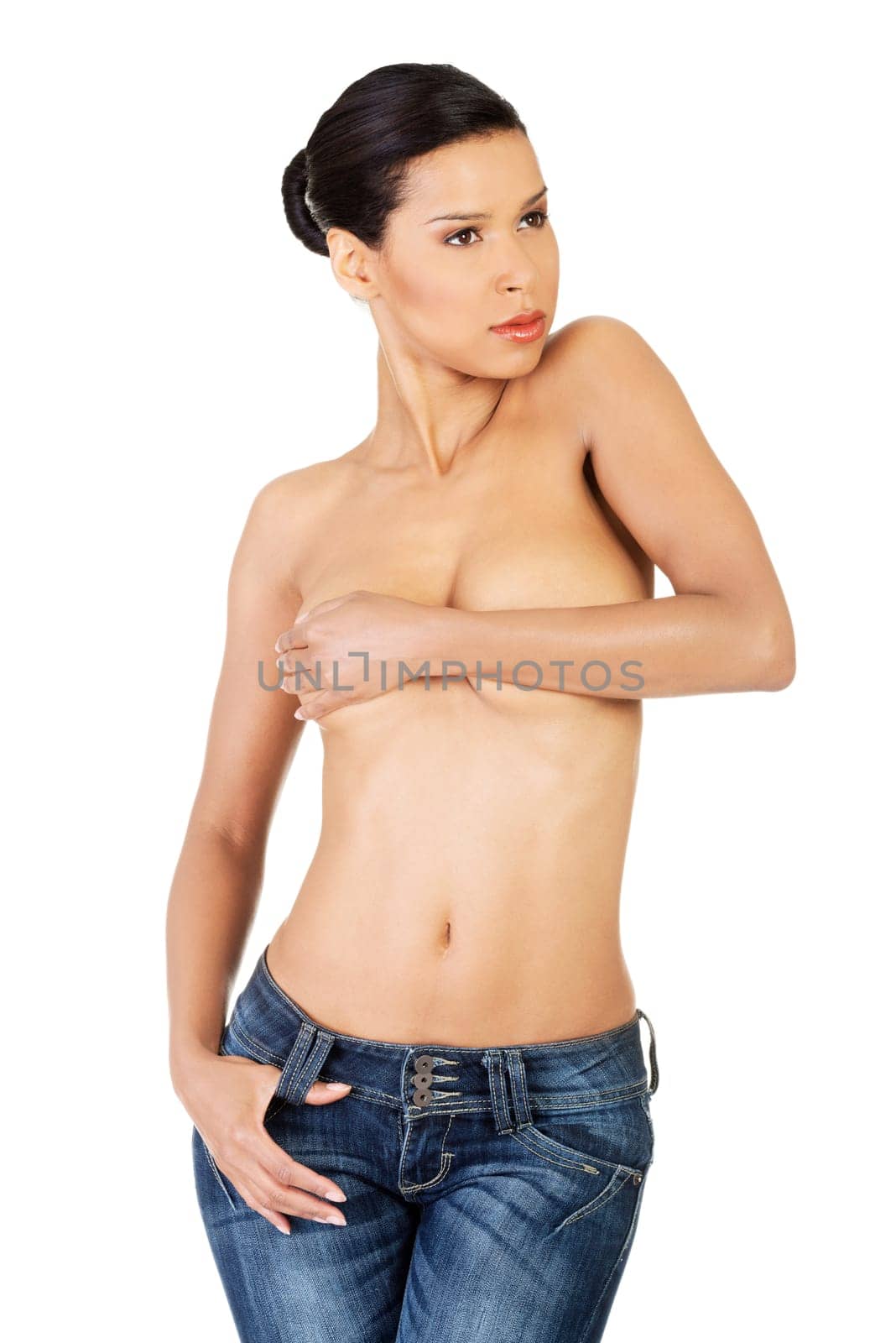 attractive woman in jeans,topless. isolated on white.