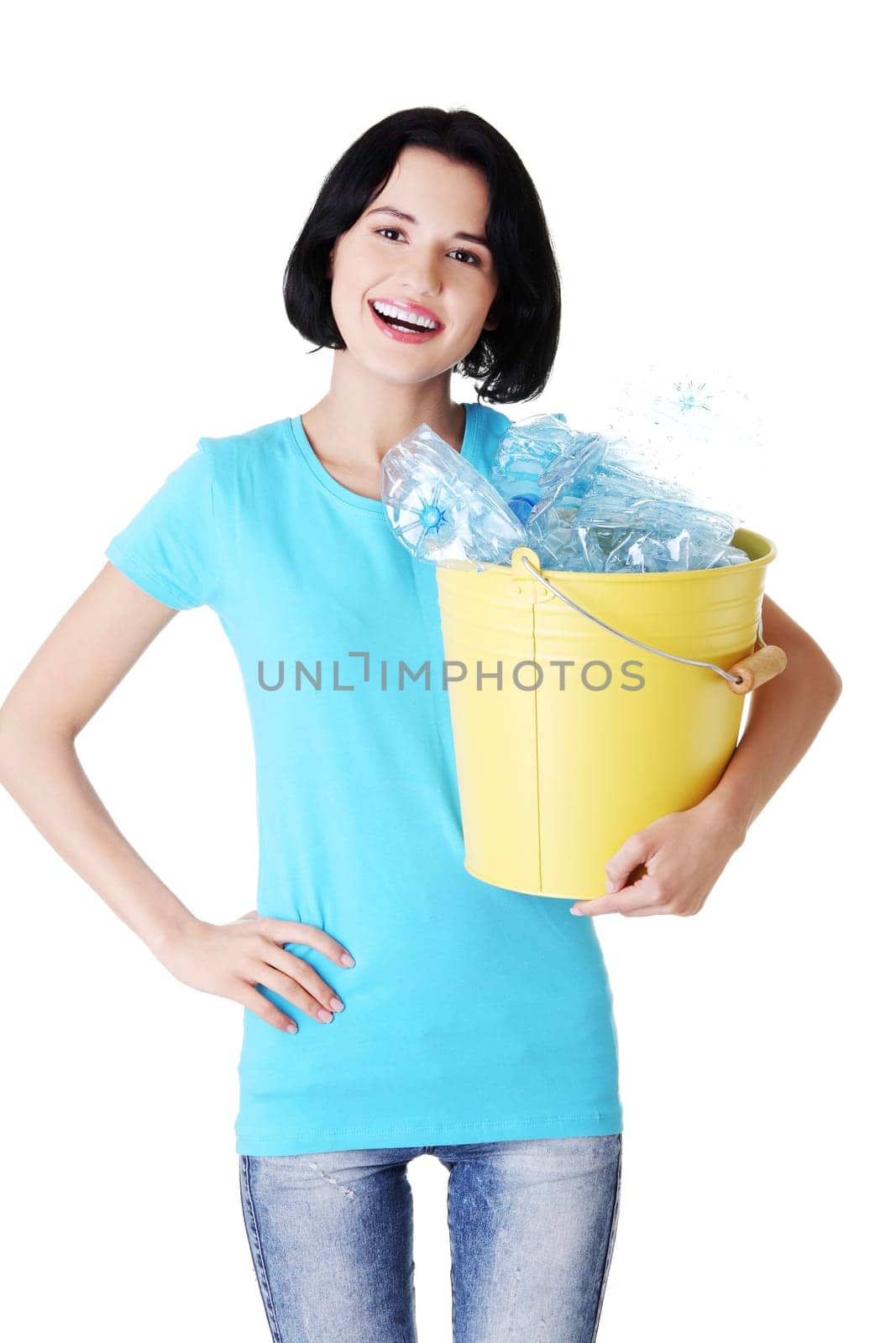 attractive woman holding bin with plastic bottles. recycling. isolated on white.