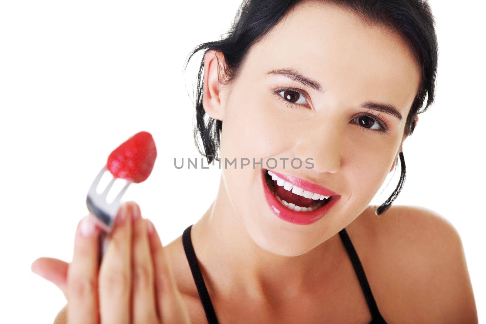 portrait of a woman with srtawberry on fork. isolated on white.