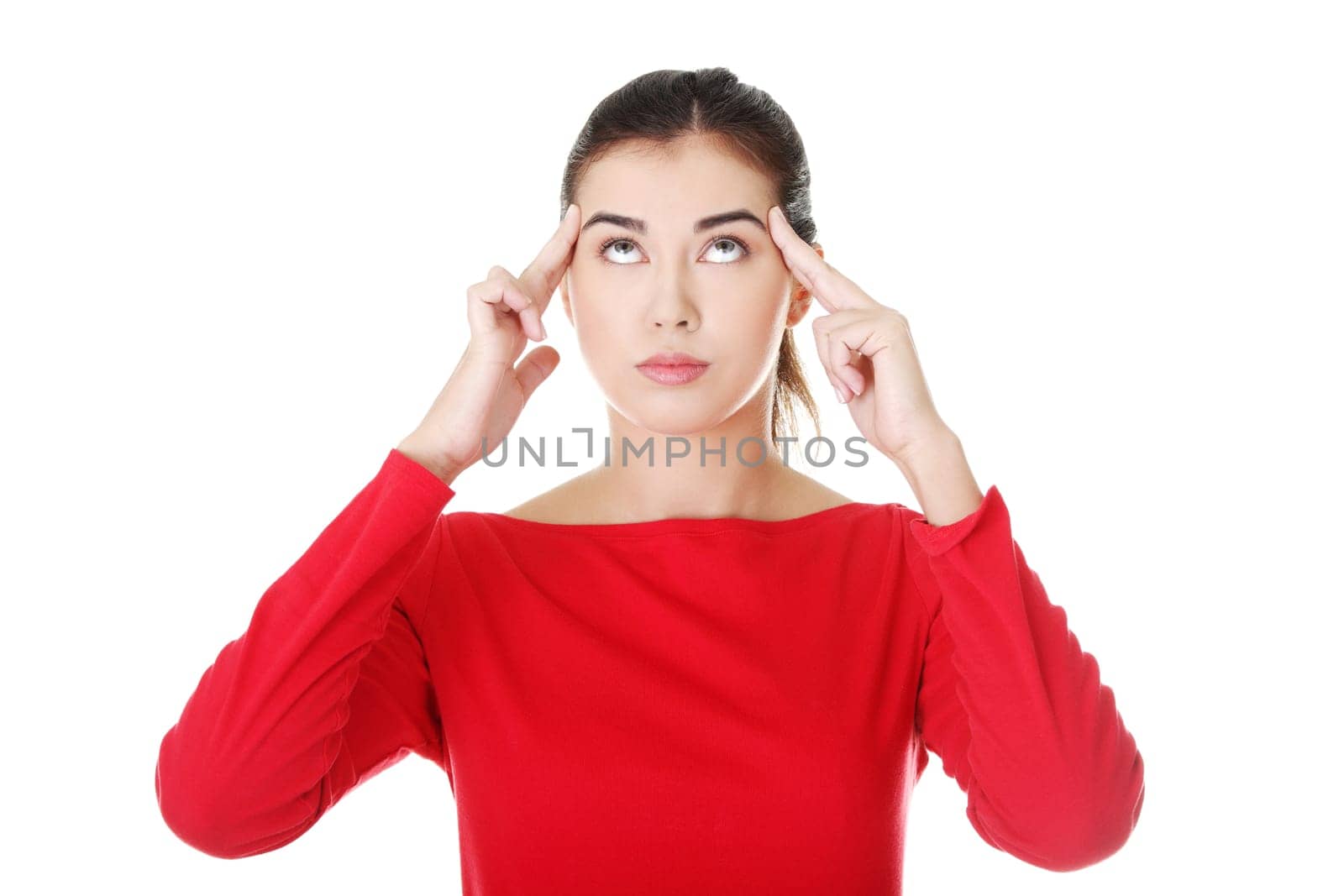 attractive woman putting fingers on her temple. isolated on white.