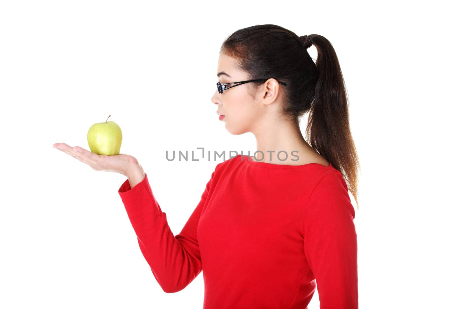 attractive woman in eyeglasses with apple on hand. isolated on white.