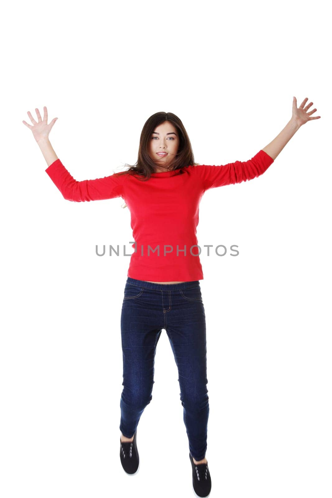 attractive woman with spread hands up. isolated on white.