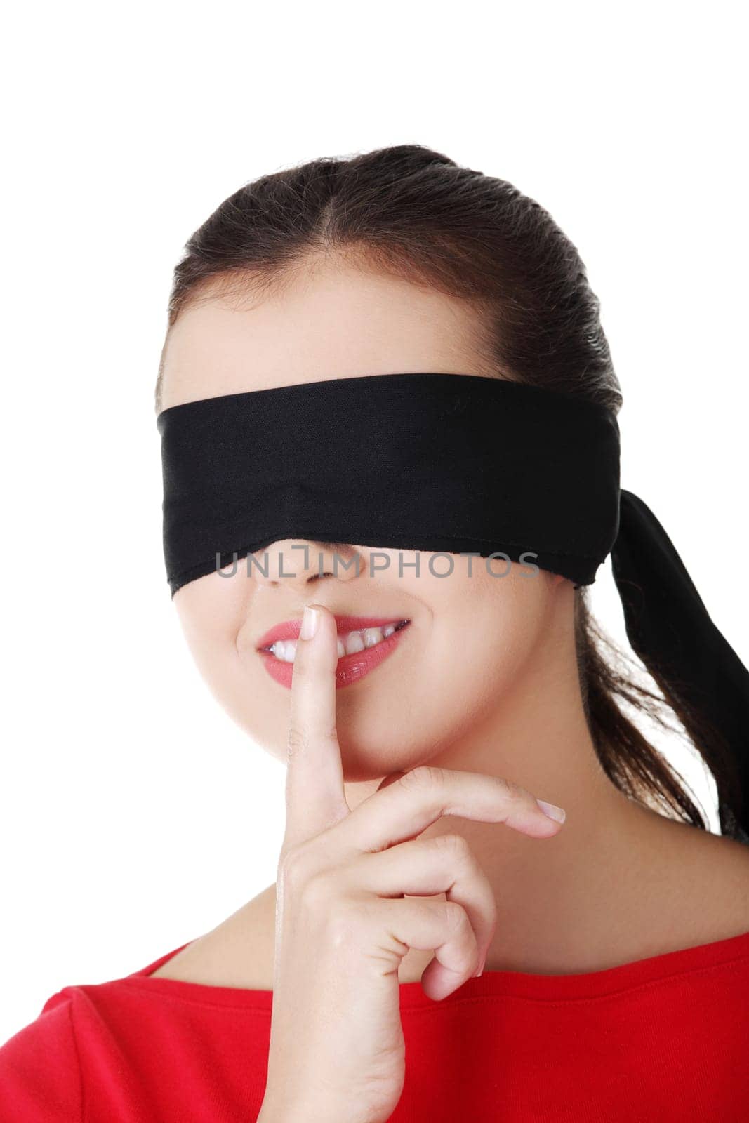 attractive cheerful girl with band on eyes. isolated on white.