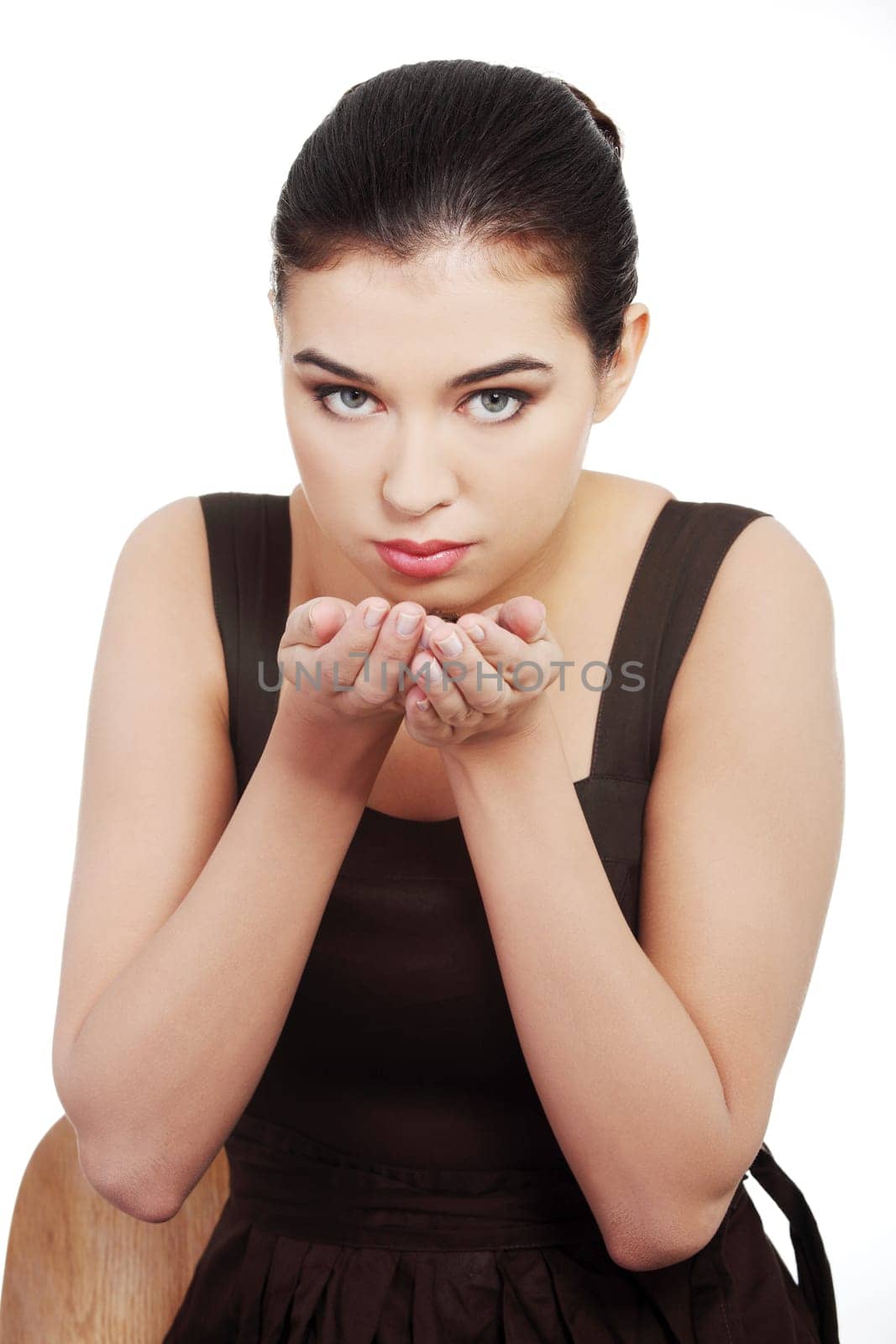 beautiful woman sitting holdig and coffee beans in hands. isolated on white.