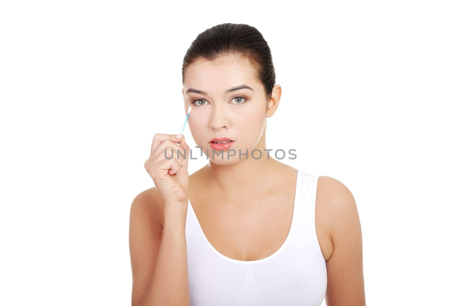 attractive woman with cotton stick. isolated on white.