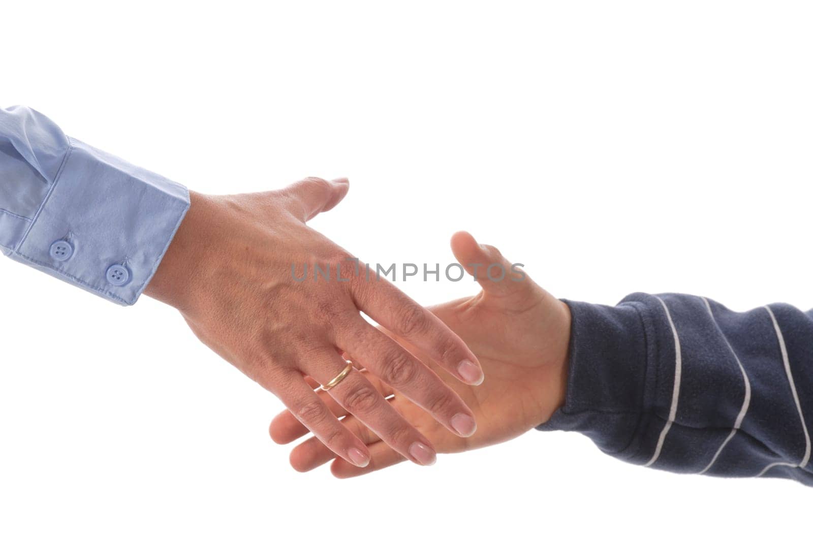Mother and son shake hands in front of a white background.