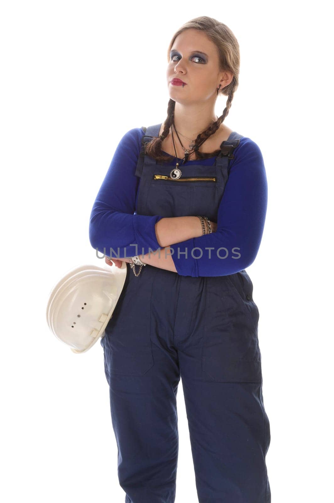 Wildew's teenage girl as an apprentice with blue man (work suit) and braids looks genervert into the camera in front of a white background