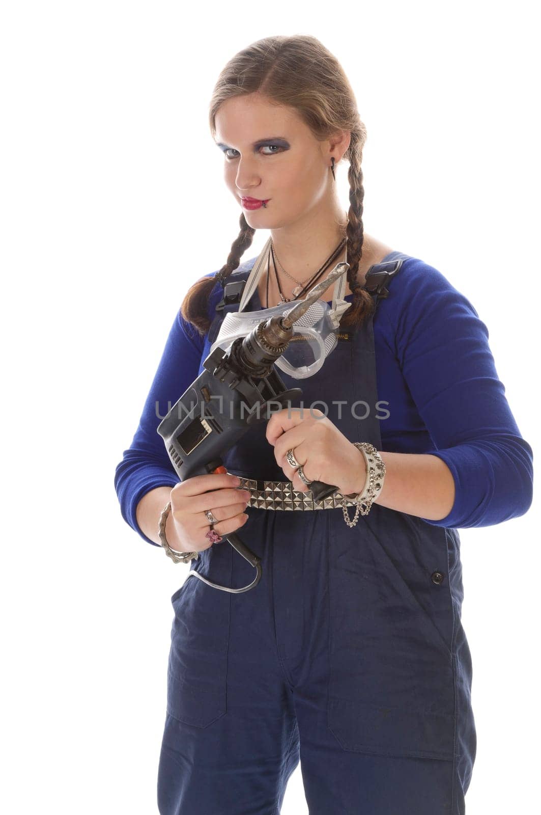 Wildew's teenage girl as a trainee (apprentice) with blue man (work suit) and braids poses with a percussion drill against a white background