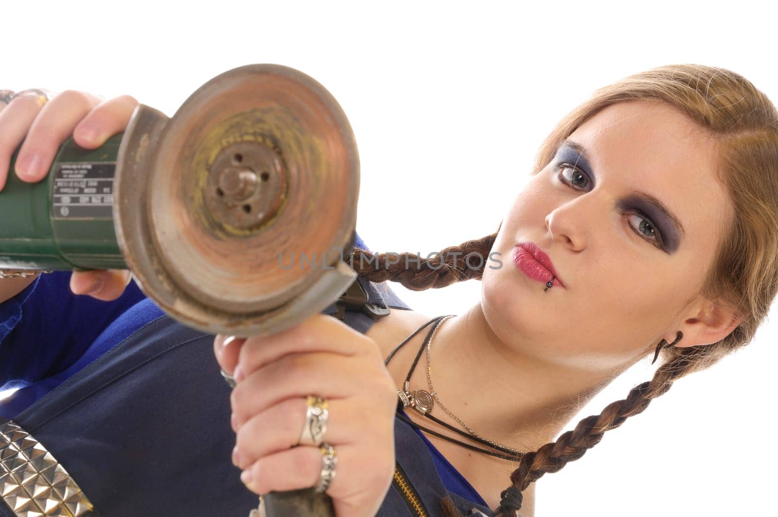 Wildew's teenage girl as a trainee (apprentice) with blue man (work suit) and braids poses with a one-handed angle grinder against a white background