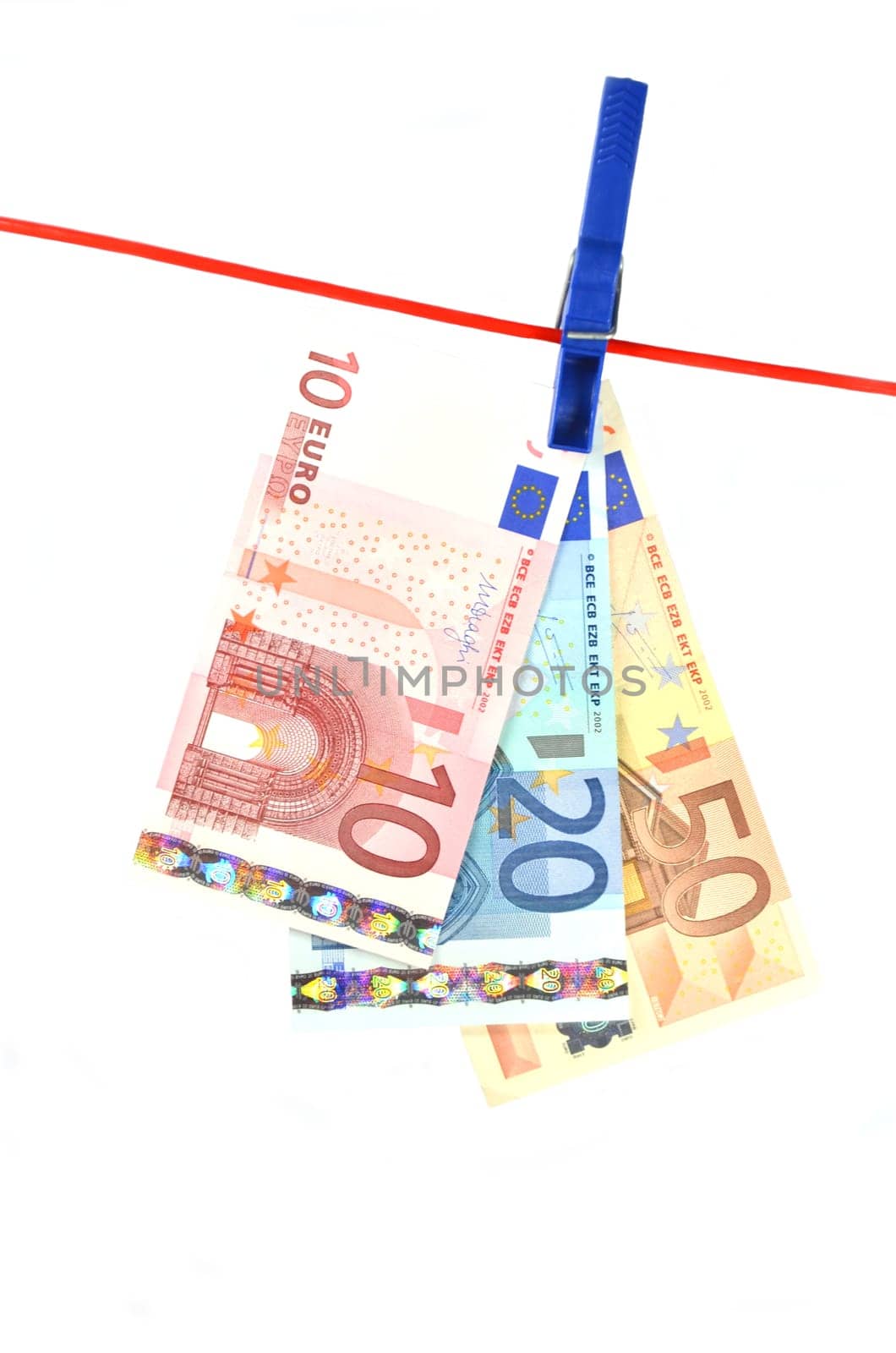drying banknotes hanging on the rope isolated on white background