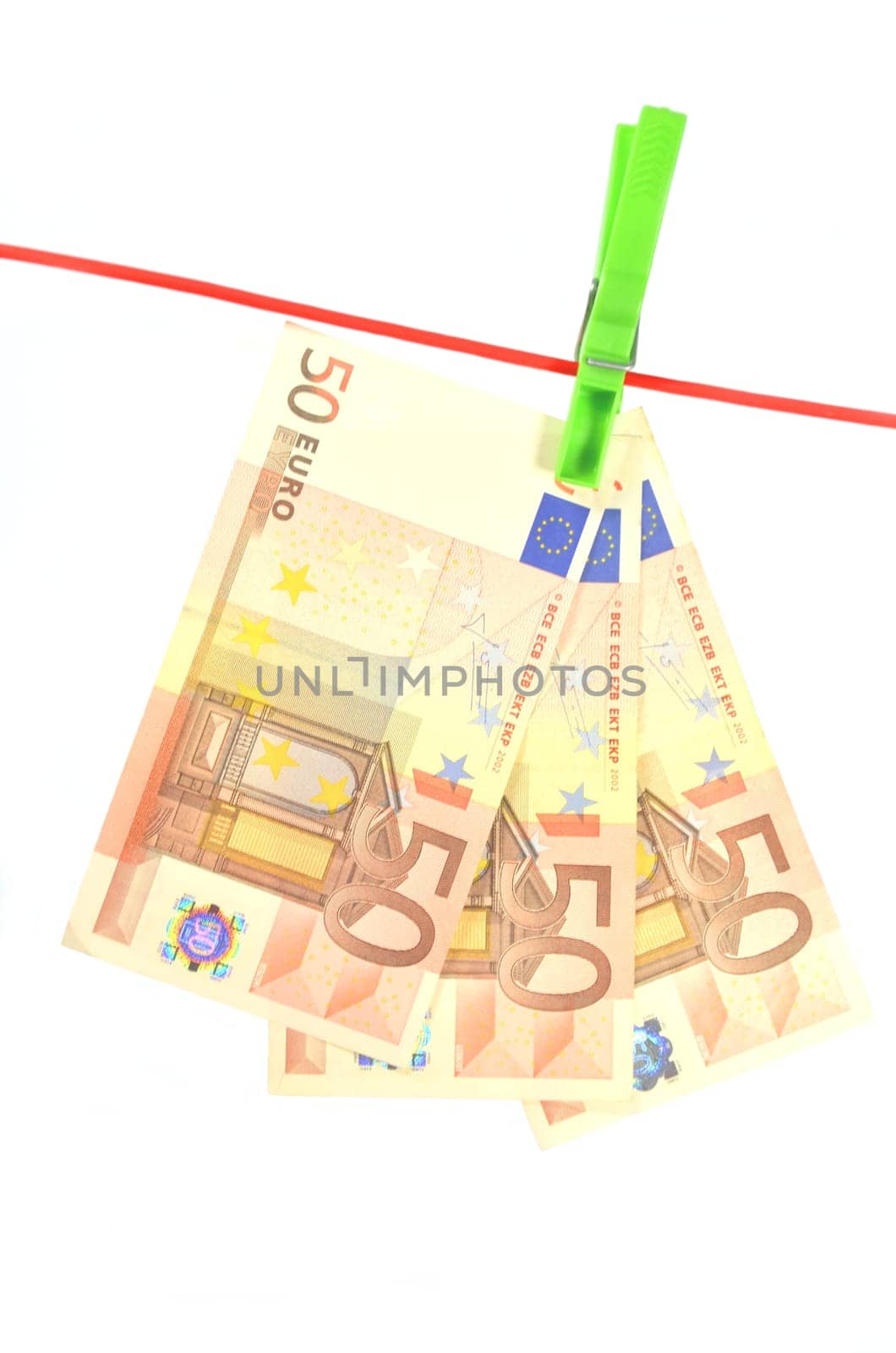 drying banknotes hanging on the rope isolated on white background