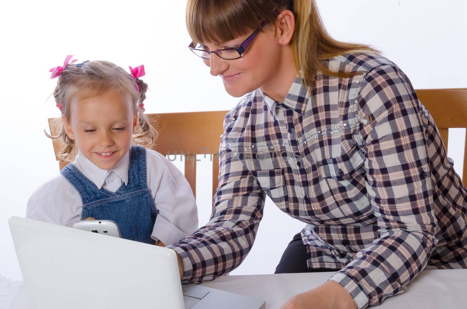 mother and daughter on the computer