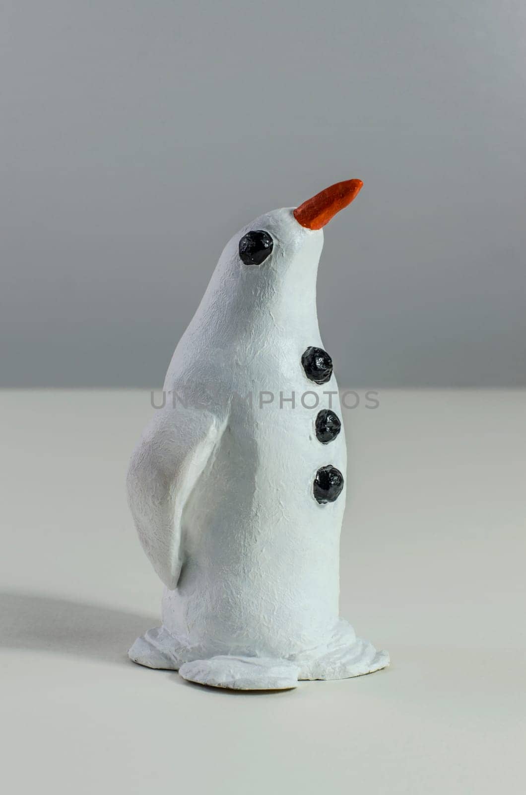 Model of a snow penguin standing proud