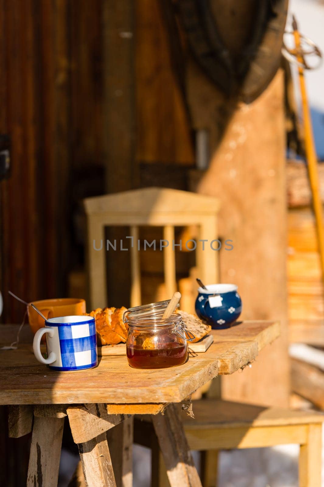 Tea and cake on wooden table winter cottage outdoor