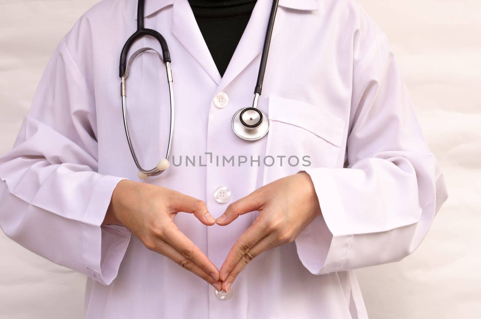 Heart hand doctor with a stethoscope isolated white background. (Medical Health Care Concept)