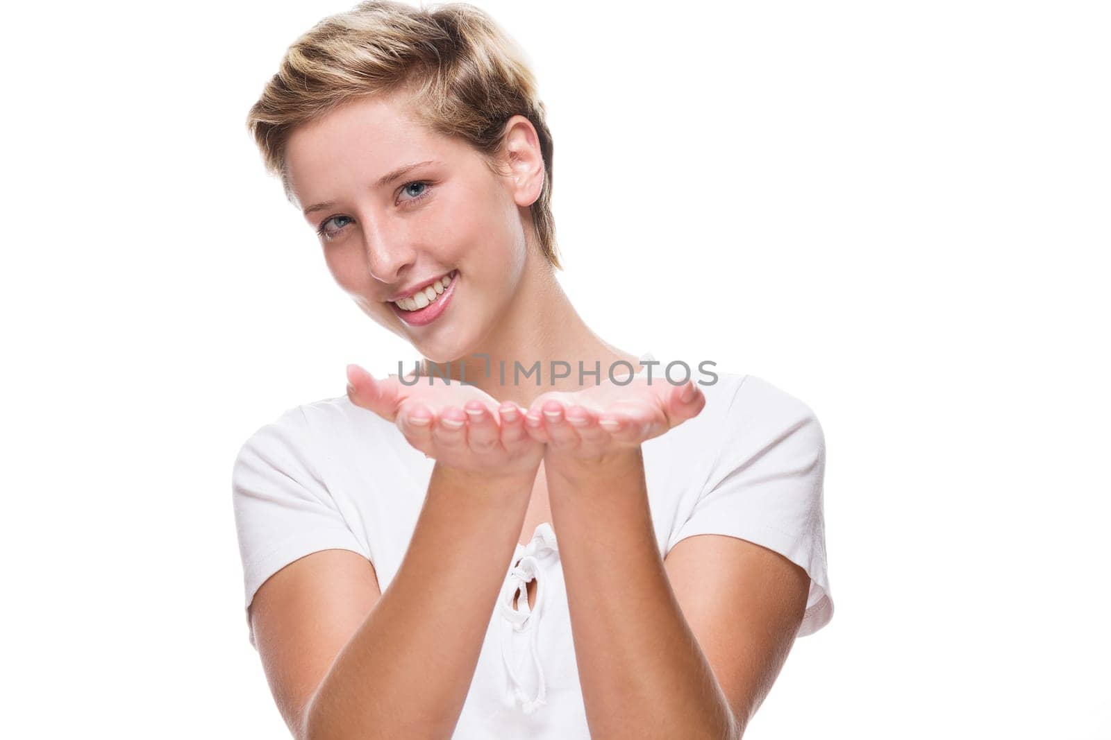 Young laughing woman holds hands for product placement on white background