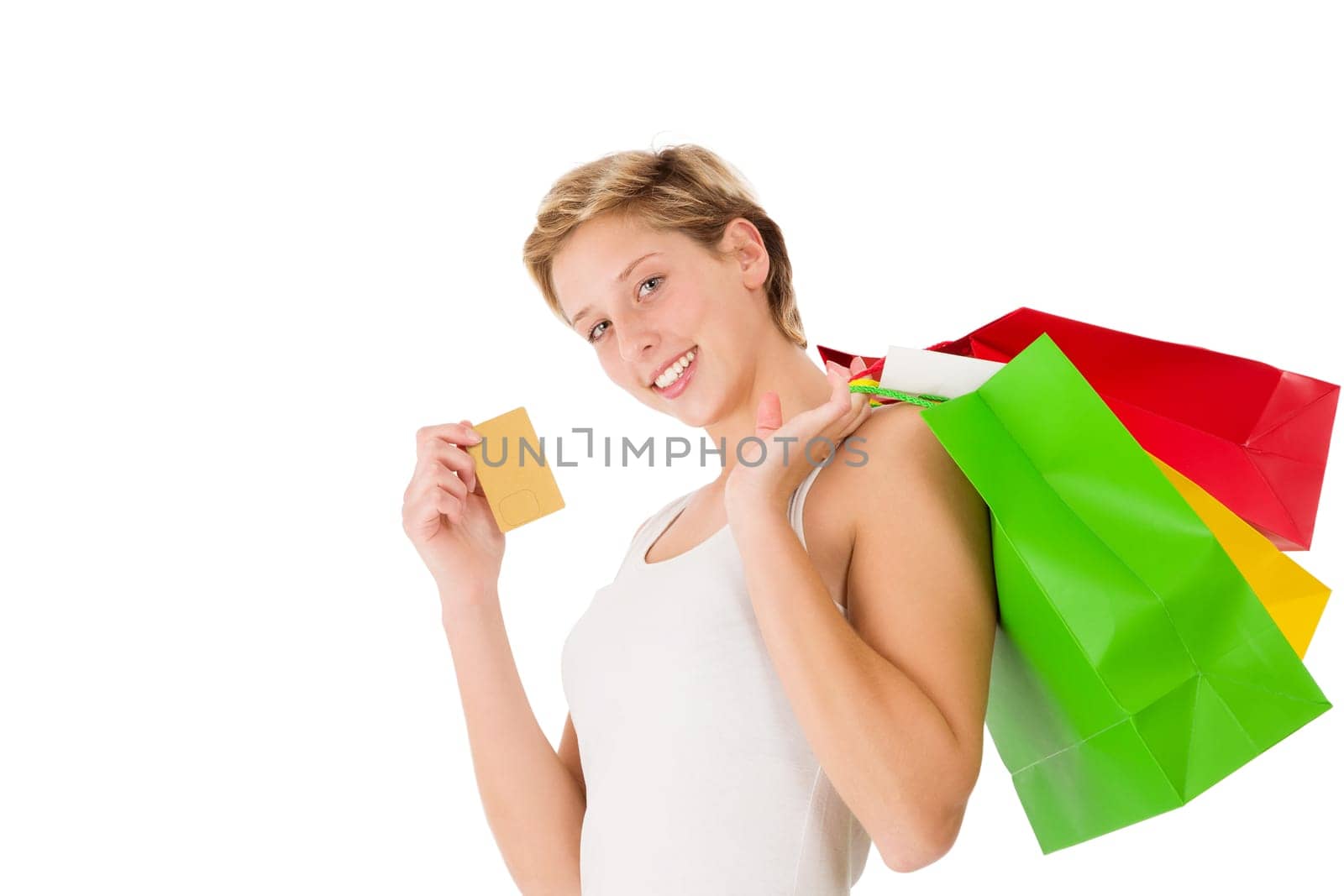 Happy woman with shopping bags and credit card on white background
