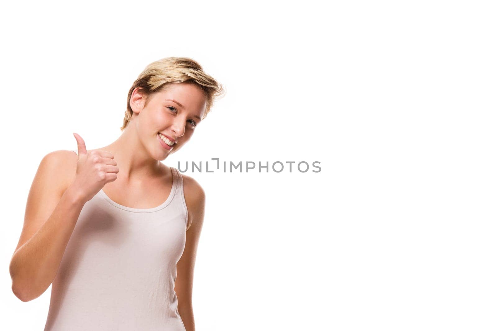 Young woman gives thumbs up on a white background
