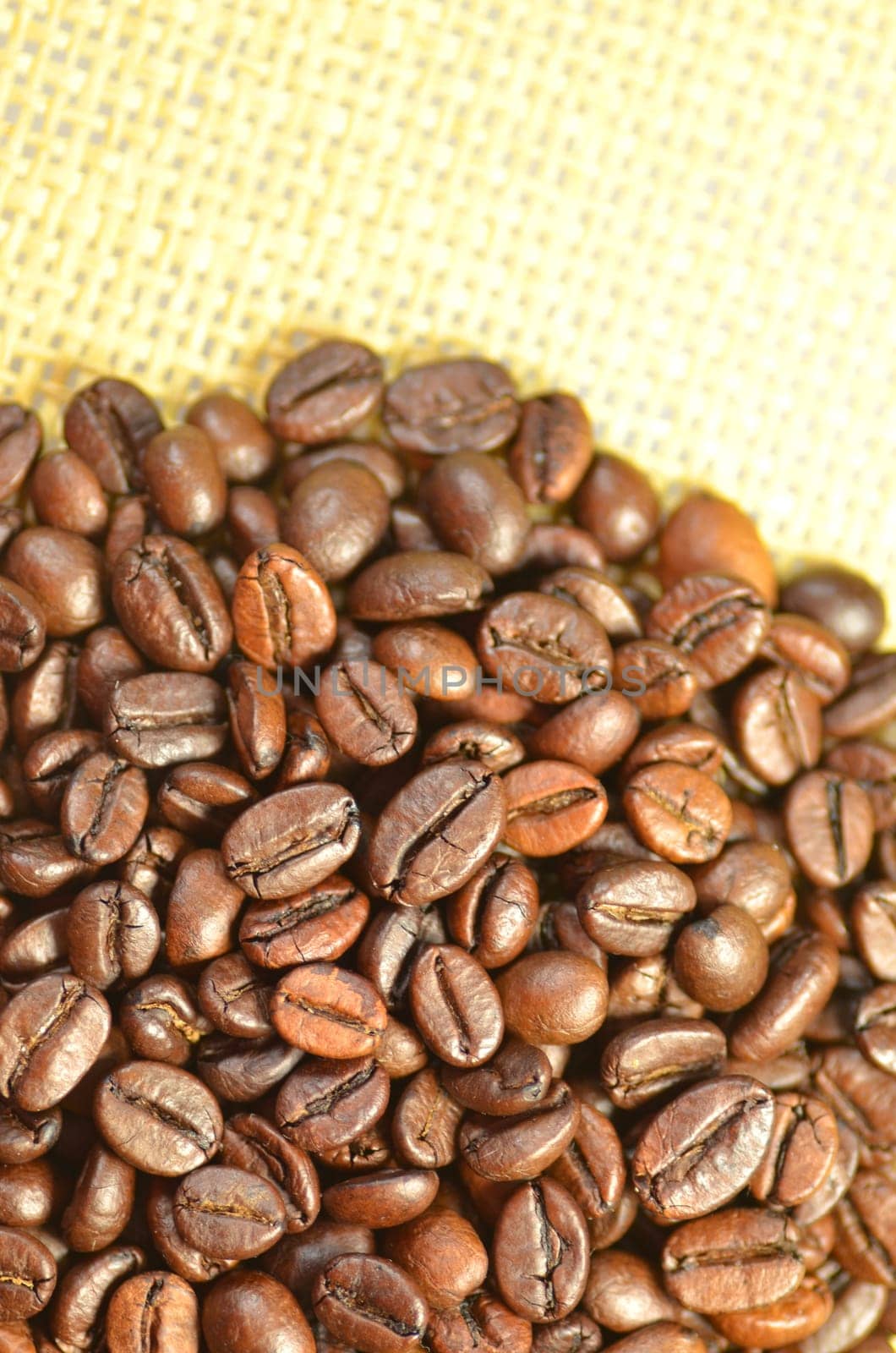 roasted coffee beans on linen surface