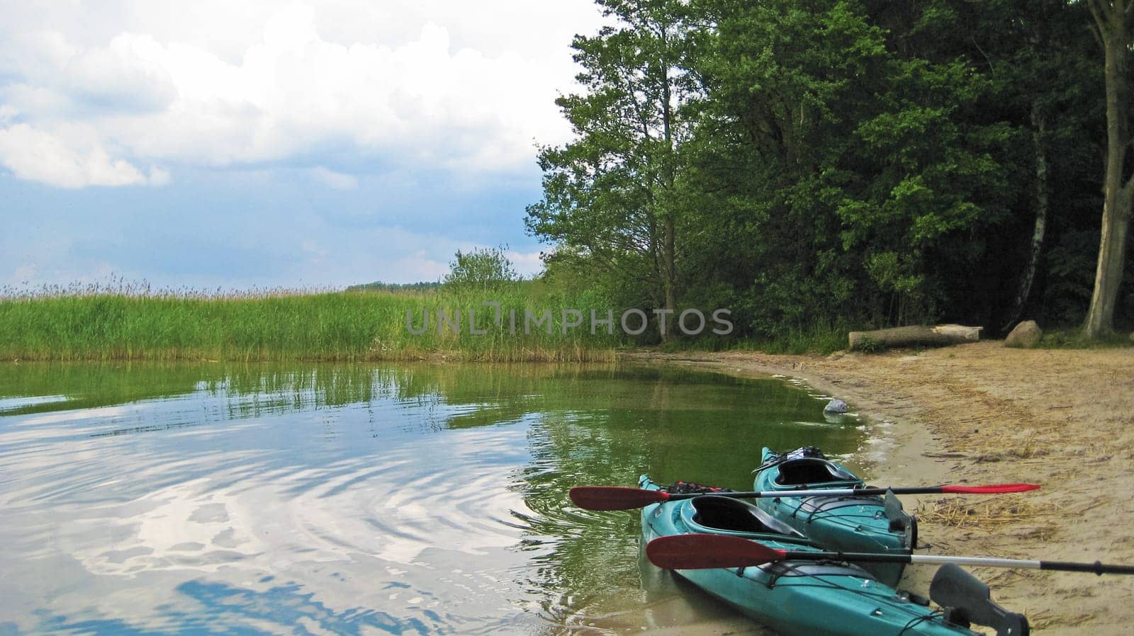 two abandoned canoes at the beach