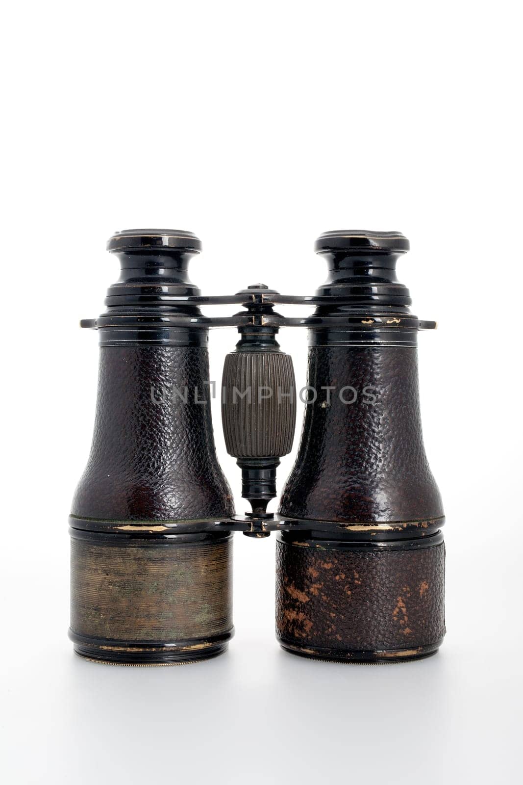 classic old black binoculars with a crippled surface
