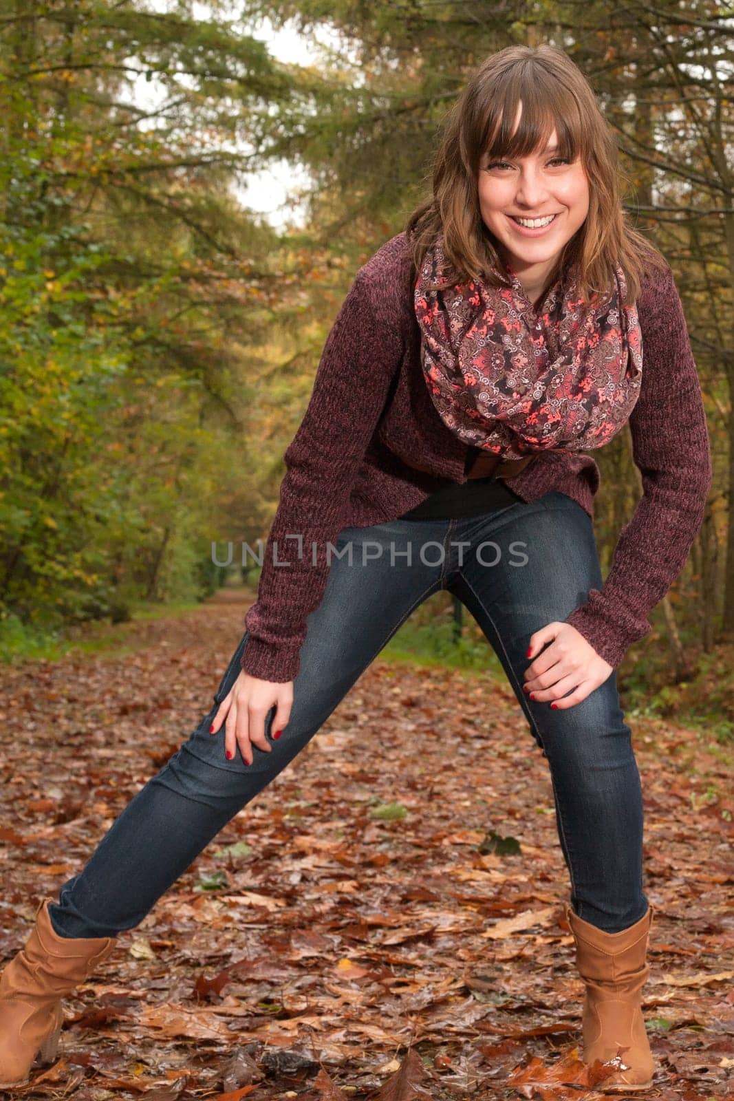 Young woman in the autumn at a cold november day