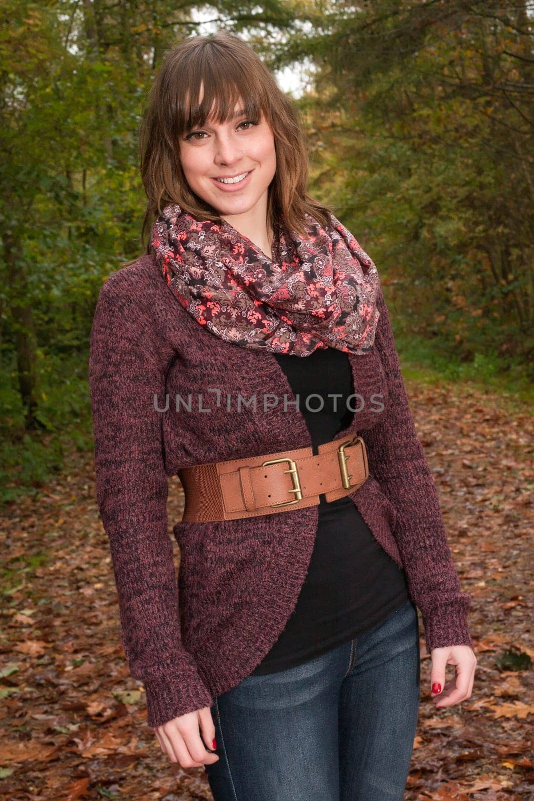 Young woman in the autumn at a cold november day