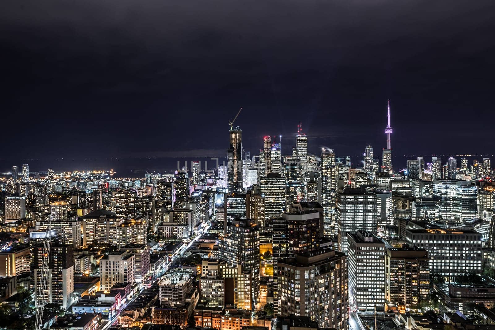 Full view of downtown Toronto at night with glamour lights