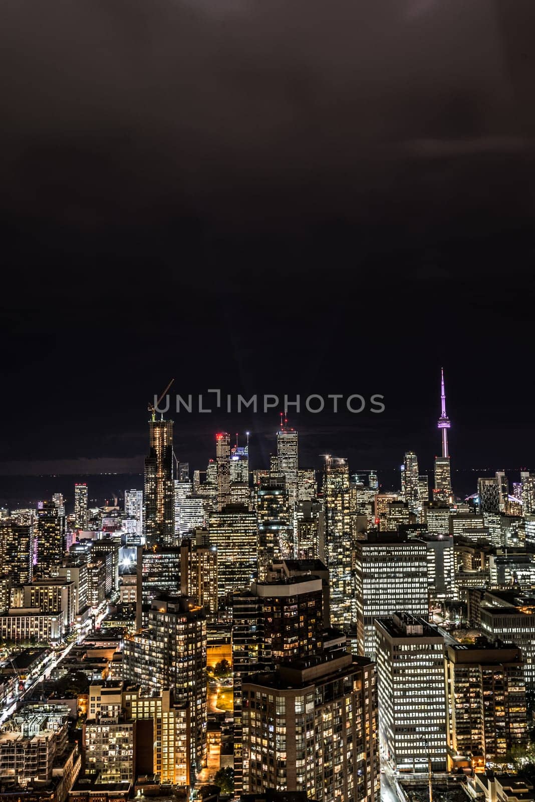 Full view of downtown Toronto at night with glamour lights