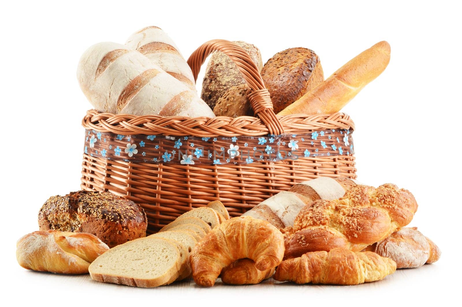 Wicker basket with baking products isolated on white