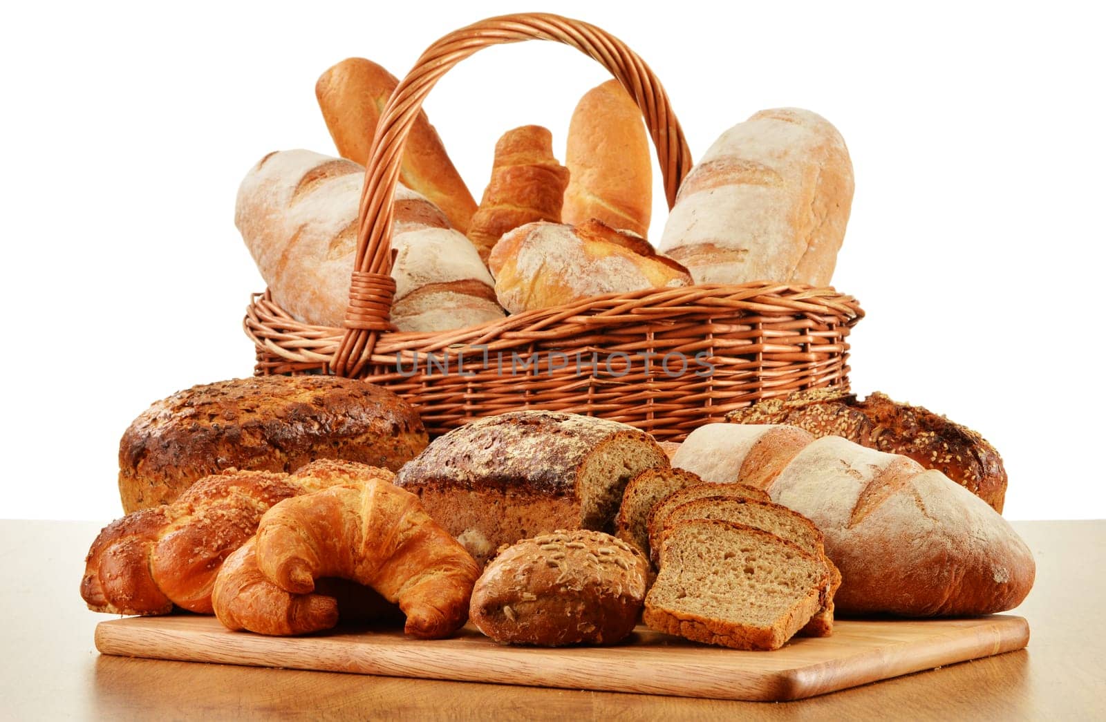 Wicker basket with baking products isolated on white