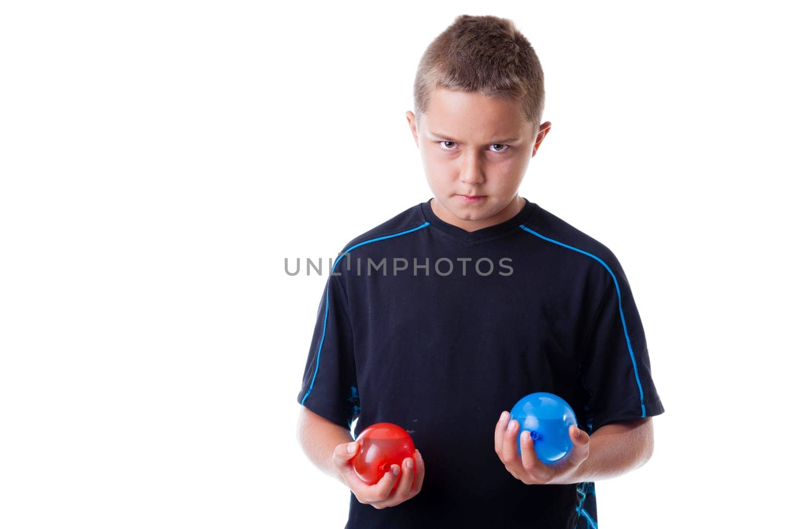 Boy holding water balloons isolated on white background