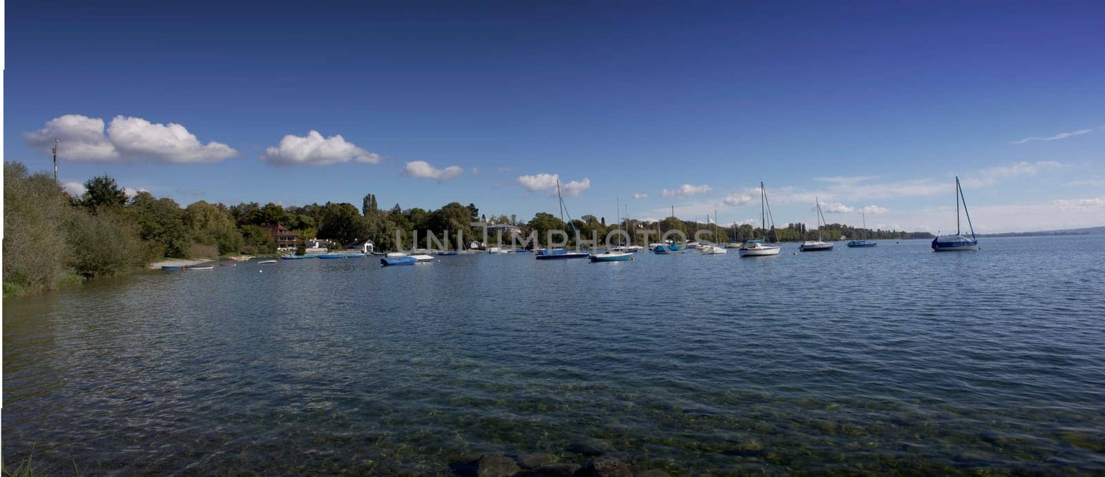 lake of constance with view to the landscape and sailing boats