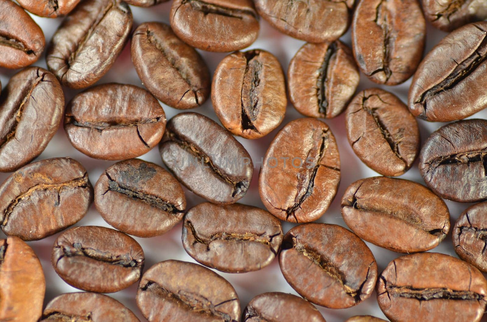 roasted coffee beans isolated on white background