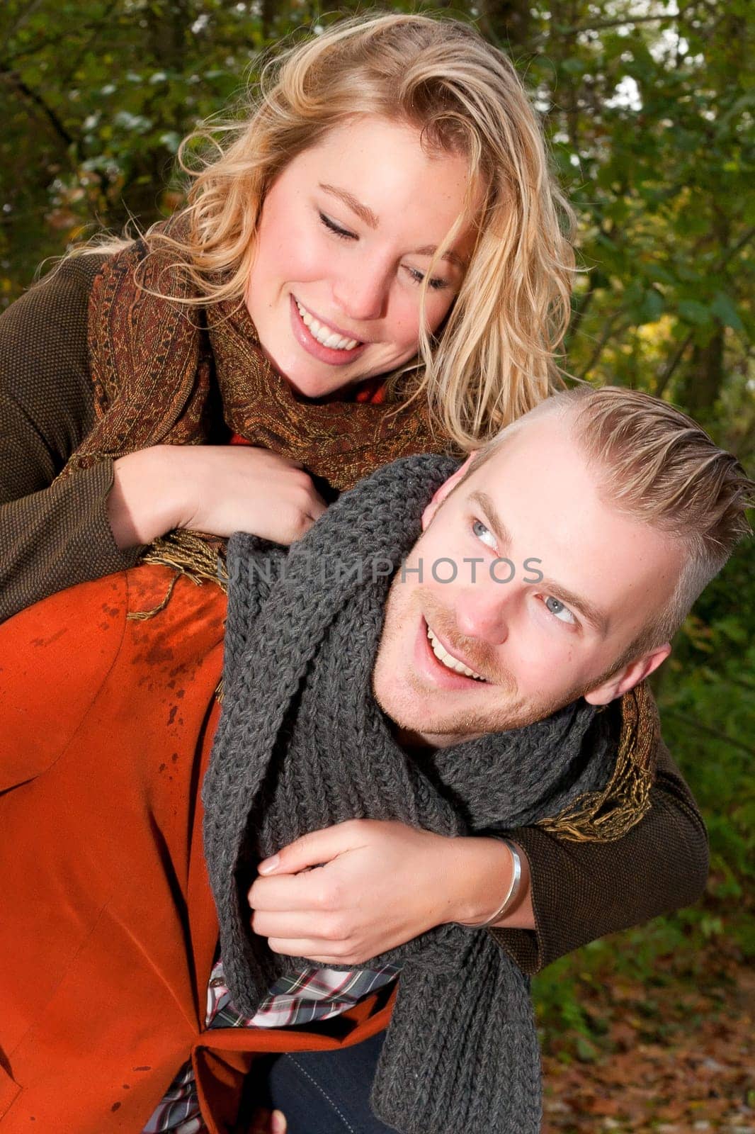 Happy young couple is having a nice time in october