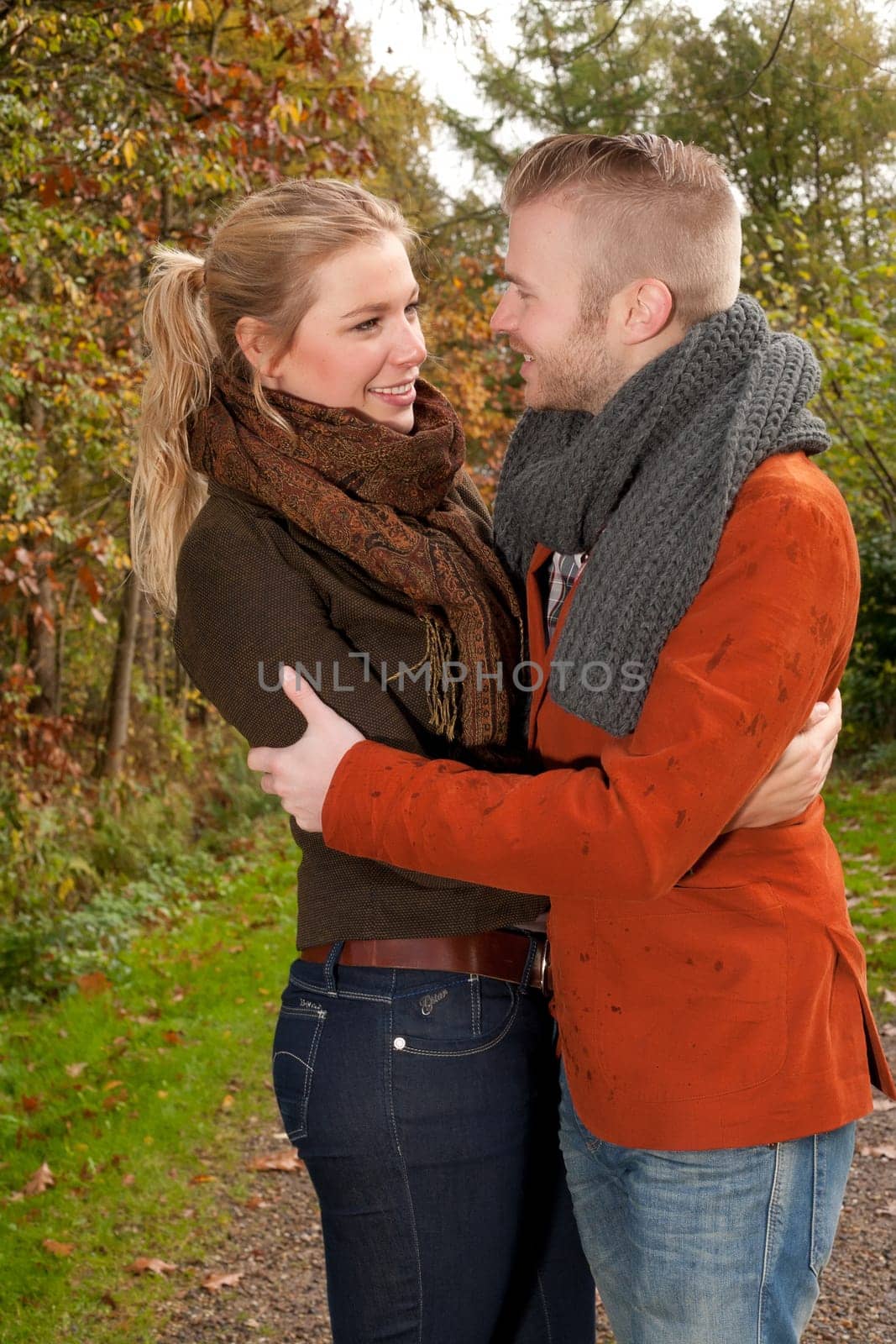 Happy young couple is having a nice time in october