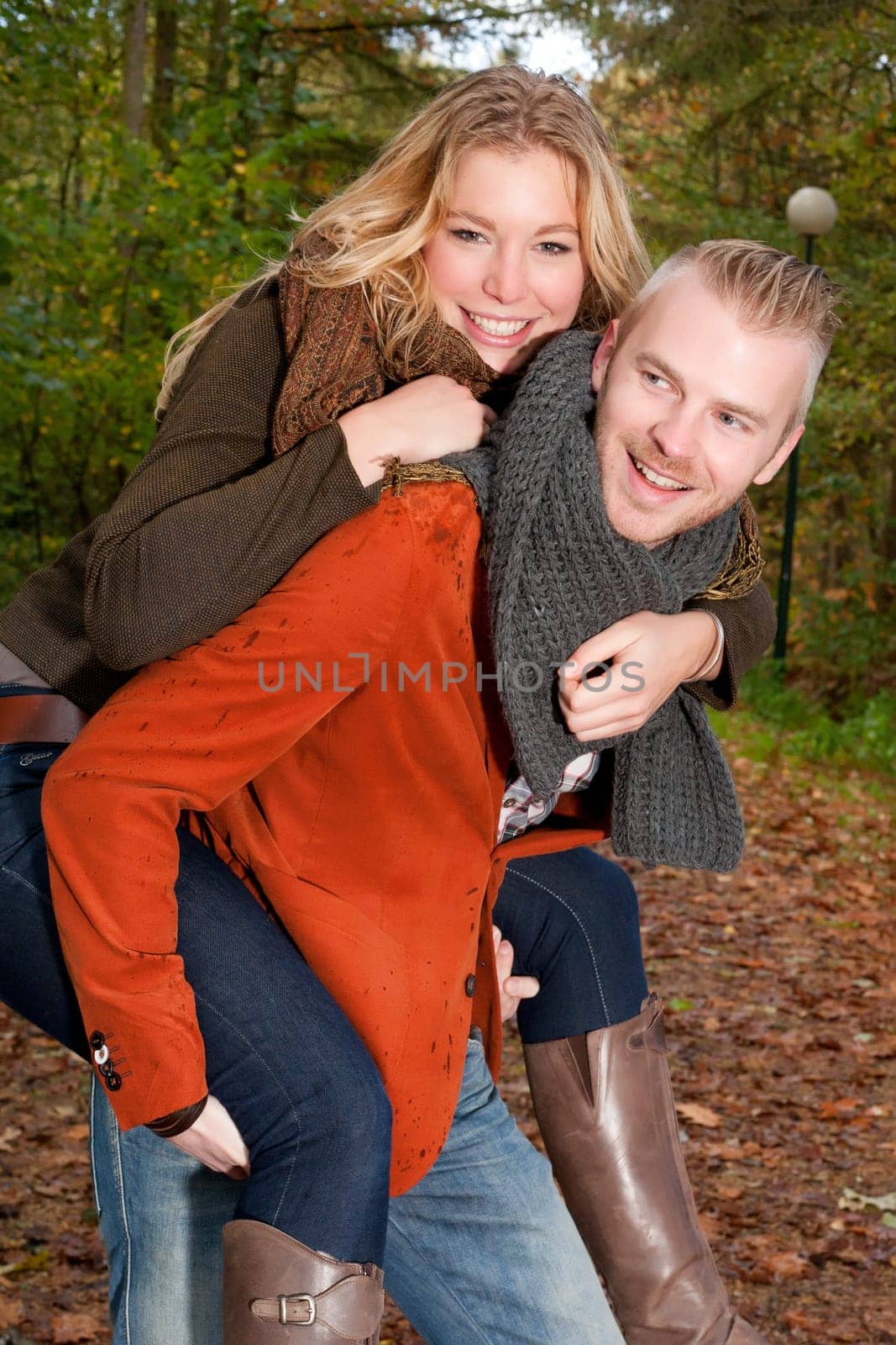 Happy young couple is having a nice time in october