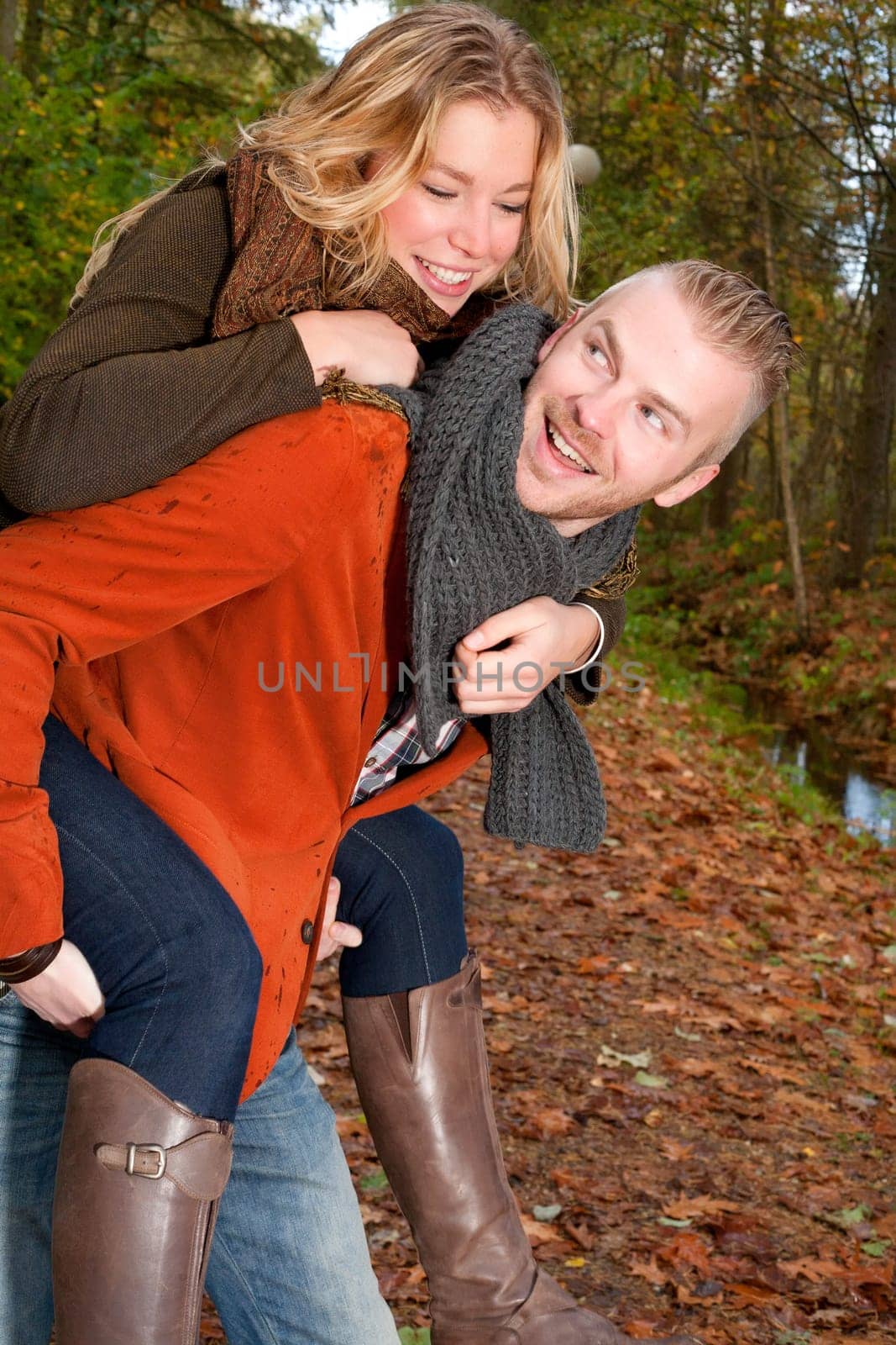 Happy young couple is having a nice time in october