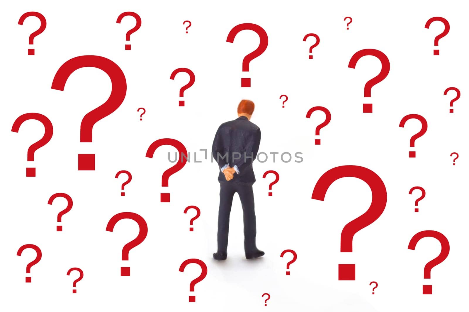 Figure of a manager from behind with red question marks