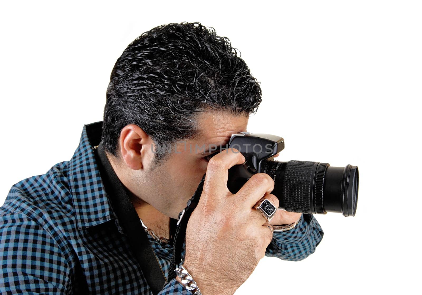 A young handsome man standing and taking pictures with his camera.for white background..