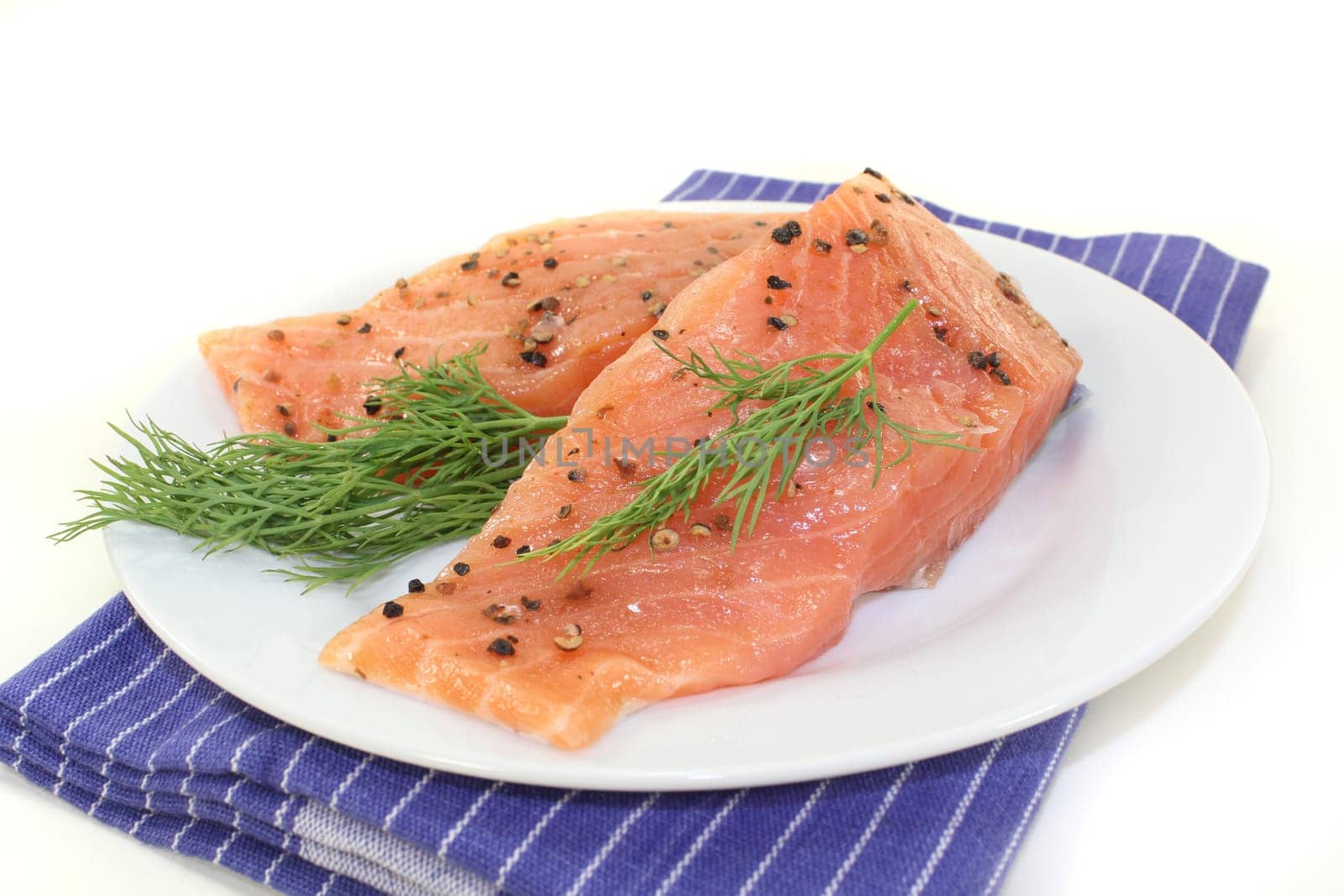 two raw salmon pieces with dill