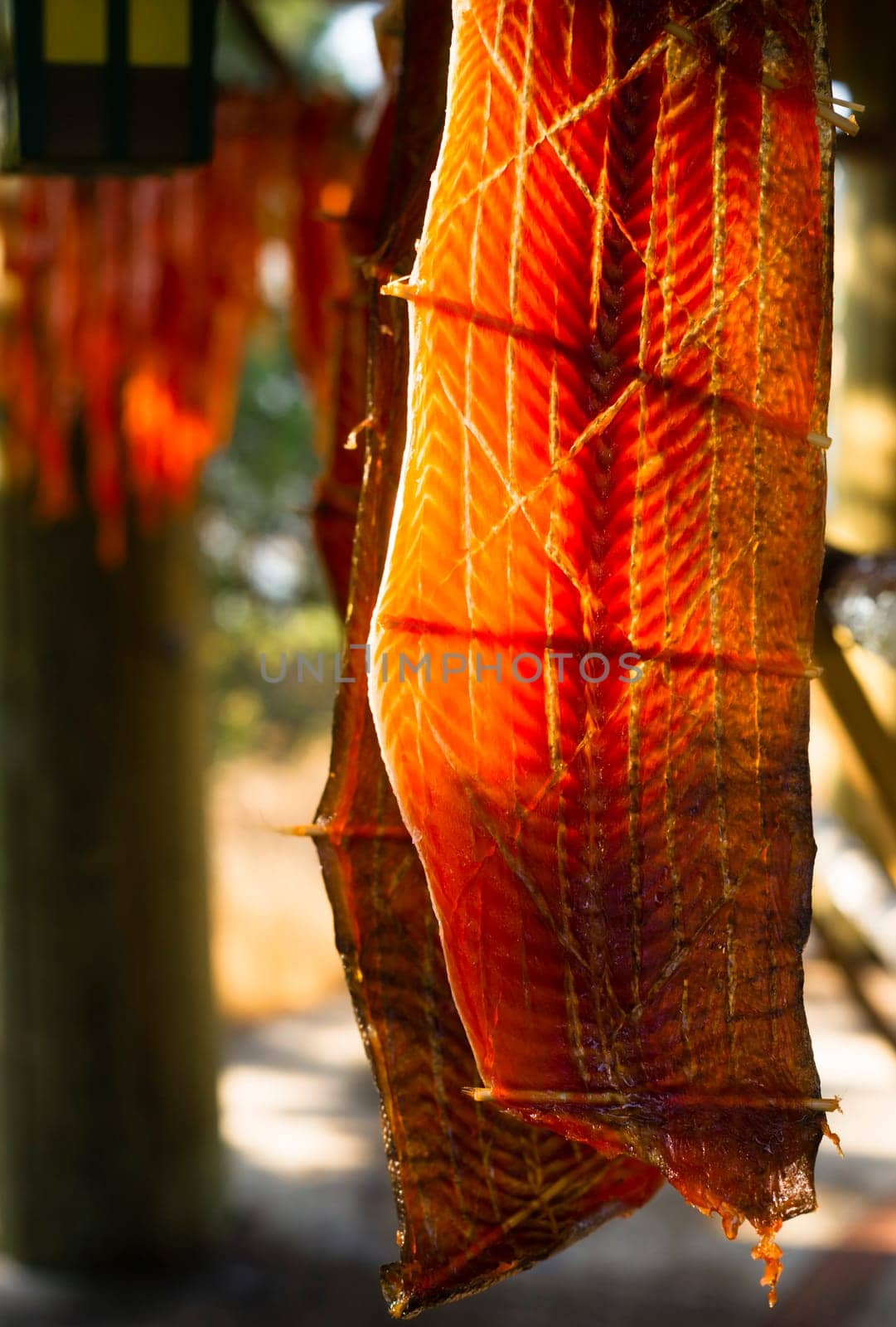 Meat is cut and hanged to dry outdoors in the lodge