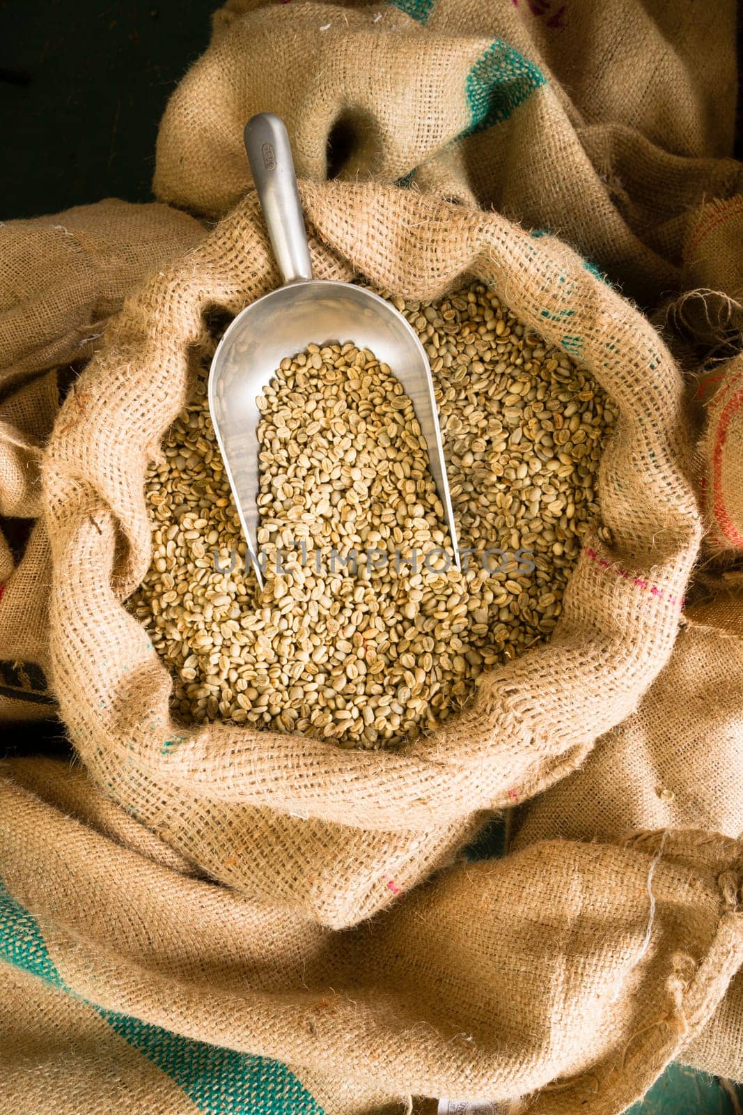 Big sack of coffee beans waiting to be roasted in coffee roaster warehouse