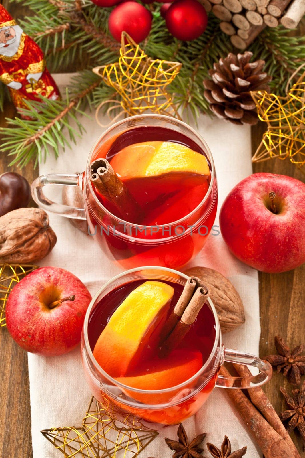 Hot drink for Christmas with cinnamon and oranges