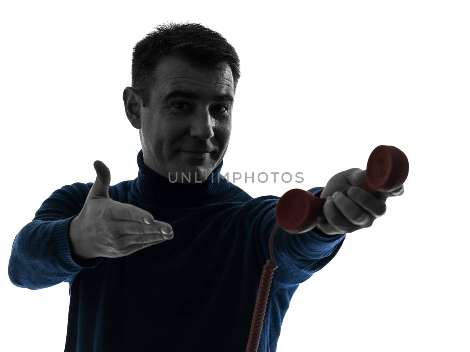 one caucasian man on the phone portrait in silhouette studio isolated on white background
