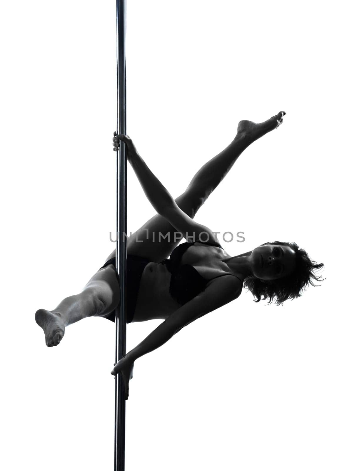 one caucasian woman pole dancer dancing in silhouette studio isolated on white background